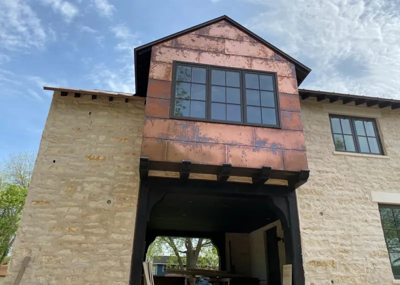 Copper metal panel facade on a stone building for Skylight Installation in Bushkill