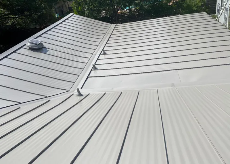 Solar attic fan installed on a metal roof for Roof Ventilation in Bushkill